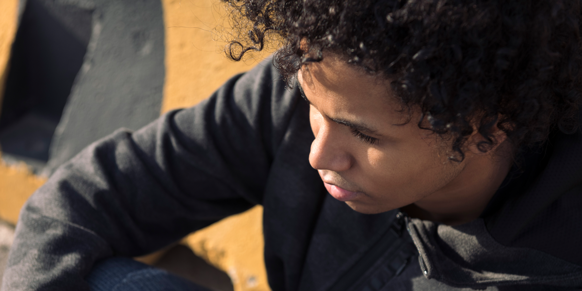 Young Latin American man in the sunshine, representative survivor of human trafficking