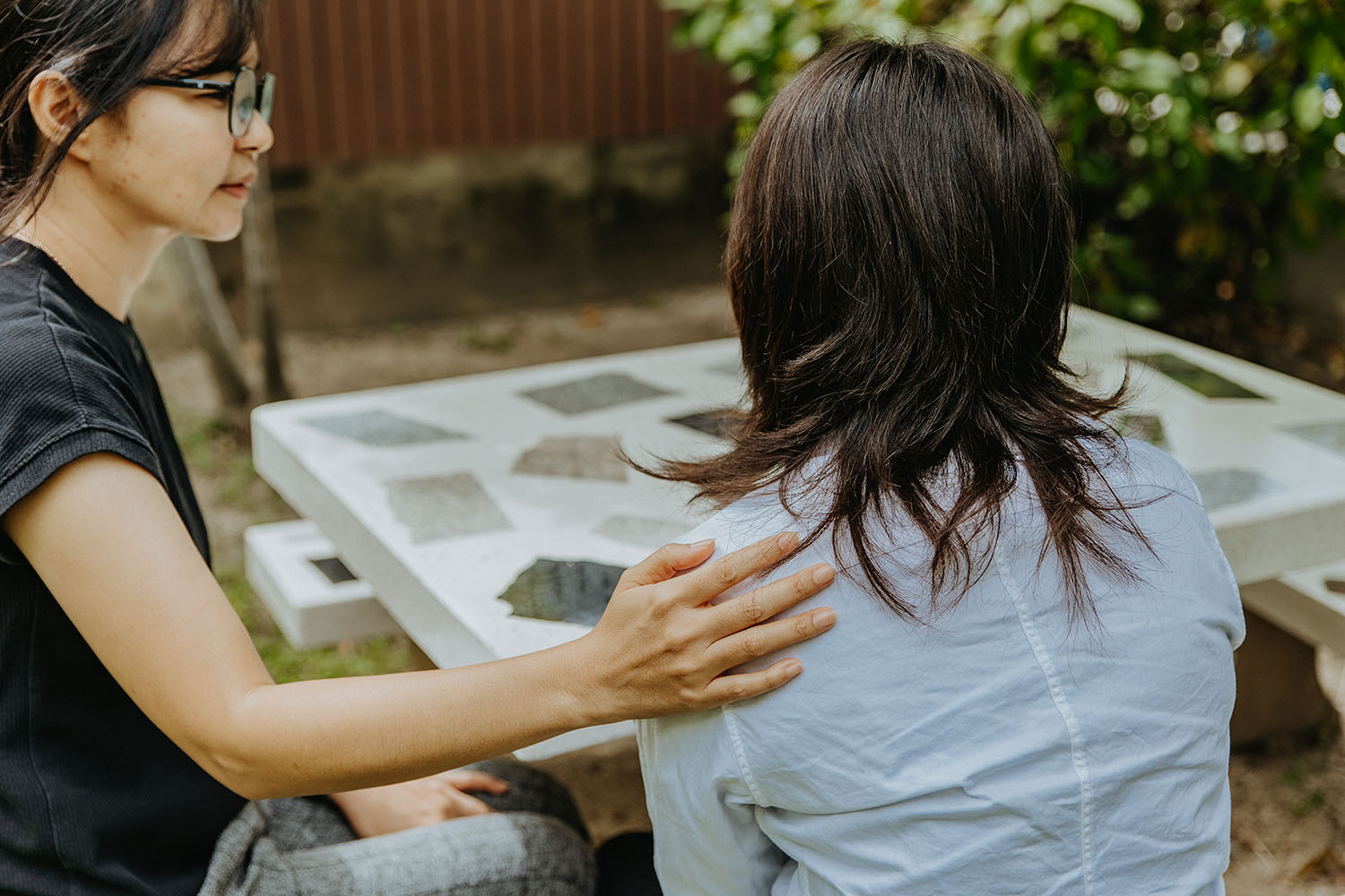 Sex trafficking survivor, Som, sitting with one of The Exodus Road's social workers at Freedom Home in Thailand