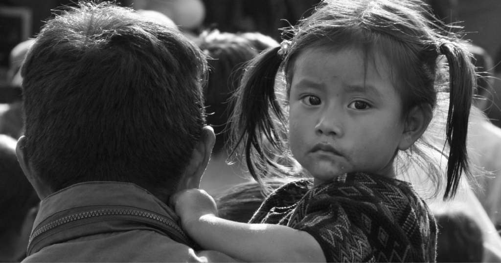 Latin American child looks directly at the camera, representing a child freed from forced begging