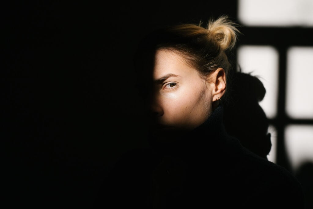 Woman's face in partial shadow