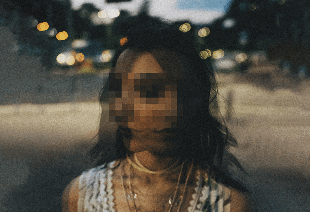 Double-exposure of a young woman outdoors