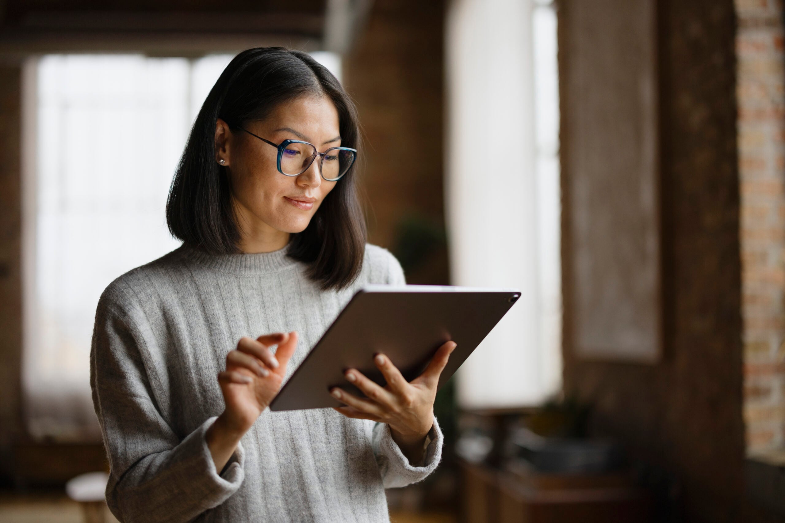 Woman reading from tablet
