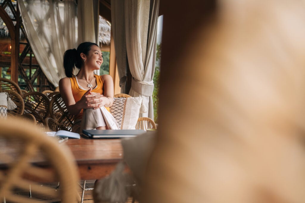 Representative image of a young woman survivor working in a boho setting