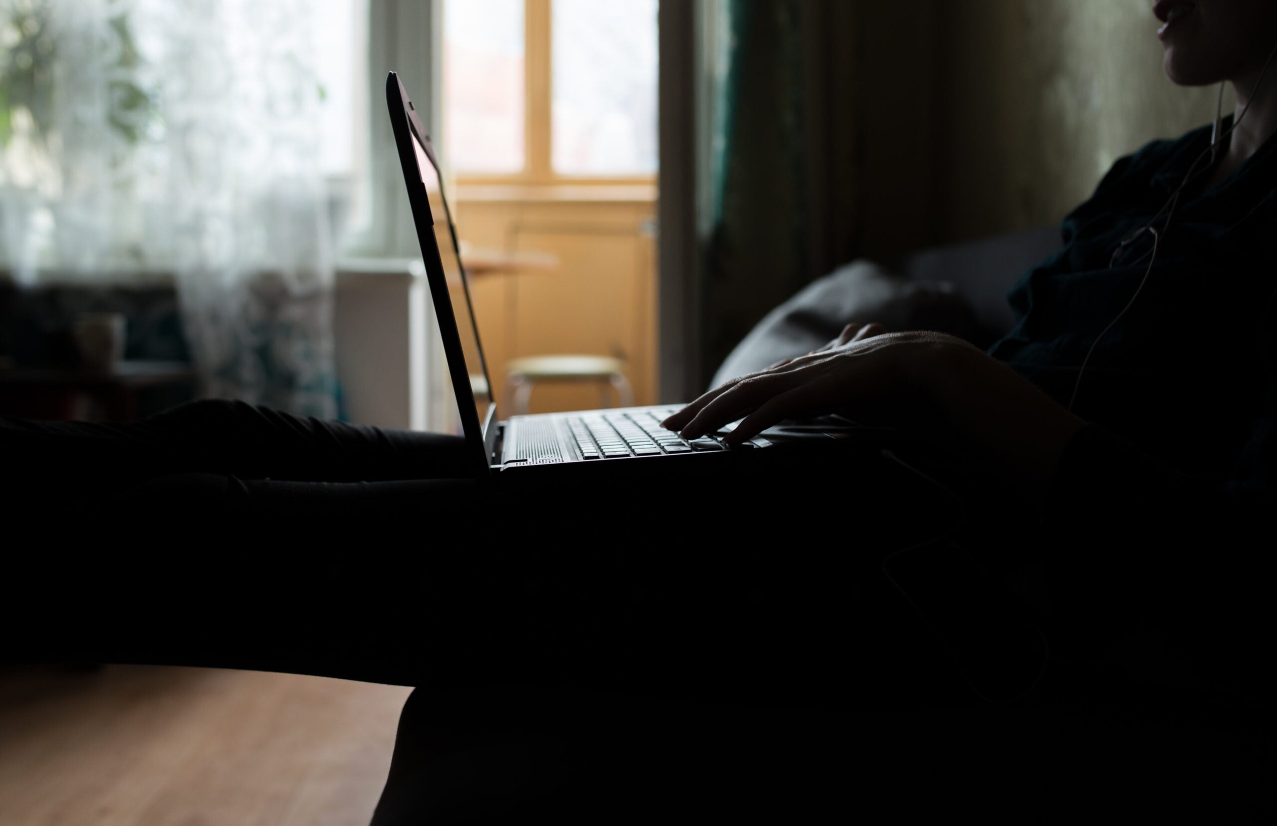 Girl on a couch with a laptop